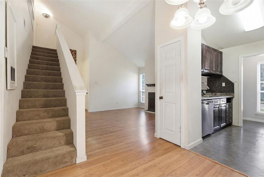 Discover stylish urban living in this beautifully designed 2-story condo at 5981 Arapaho Rd #602 in Dallas. This inviting residence offers a versatile layout with dual primary suites- one upstairs and one downstairs- each featuring a private ensuite bath and walk-in closet, ideal for roommates, guests, or a home office setup!

The open-concept living area is filled with natural light and showcases vaulted ceilings, laminate flooring, and a cozy wood-burning fireplace, creating a warm and welcoming space. The kitchen flows seamlessly into the living and dining areas, perfect for everyday living and entertaining.

Enjoy a private balcony for relaxing evenings, along with the convenience of assigned covered parking and an in-unit washer and dryer. The lock-and-leave lifestyle makes this home perfect for busy schedules or low-maintenance living.

Residents of Woodhaven Condominiums enjoy access to resort-style amenities including a pool, tennis and pickleball courts, golf areas, jogging trails, and greenbelts- offering endless opportunities to unwind and stay active.

Located in a prime Dallas location with easy access to the Dallas North Tollway, George Bush, and I-635, and just minutes from Addison’s dining, shopping, and entertainment. Convenient to Addison Airport, Love Field, and DFW International Airport. Welcome home!