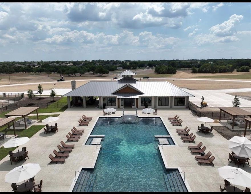 BUILD YOUR DREAM HOME ON THIS STUNNING 1.46-ACRE PRIME CORNER LOT IN THE HIGHLY SOUGHT-AFTER BYNUM SPRINGS CLUB, AN EXCITING NEW LUXURY COMMUNITY IN RED OAK JUST 20 MINUTES SOUTH OF DALLAS WITH CONVENIENT ACCESS OFF INTERSTATE 35E. This OVERSIZED HOMESITE offers the perfect blend of privacy and presence, sitting on a premium corner with excellent drainage and utilities and water already installed—saving you time and money as you begin building. Lot 37 is the PERFECT LOCATION-WALKING DISTANCE TO THE CLUBHOUSE! With nearly an acre and a half, there’s plenty of room for a custom estate, pool, outdoor kitchen, or expansive backyard retreat. LIFE AT BYNUM SPRINGS CLUB FEELS LIKE A YEAR-ROUND VACATION. RESIDENTS ENJOY RESORT-STYLE AMENITIES INCLUDING A SPARKLING RESORT POOL, SPLASH PAD, OUTDOOR PARTY PAVILION, ELEGANT CLUBHOUSE, AND STATE-OF-THE-ART FITNESS CENTER. STAY ACTIVE WITH PICKLEBALL, TENNIS, BASKETBALL, SAND VOLLEYBALL, BADMINTON, AND MINI GOLF. MULTIPLE PLAYGROUNDS AND MILES OF SCENIC WALKING AND JOGGING TRAILS CREATE THE PERFECT BALANCE OF RECREATION AND RELAXATION. Whether you’re envisioning a modern masterpiece or a timeless custom home, this spacious lot provides the ideal canvas in one of the fastest-growing areas south of Dallas. Rare corner lots of this size in a gated, amenity-rich community don’t come available often—secure your piece of Bynum Springs Club and start building the lifestyle you’ve been dreaming of. BYOB Bring Your Own Builder!