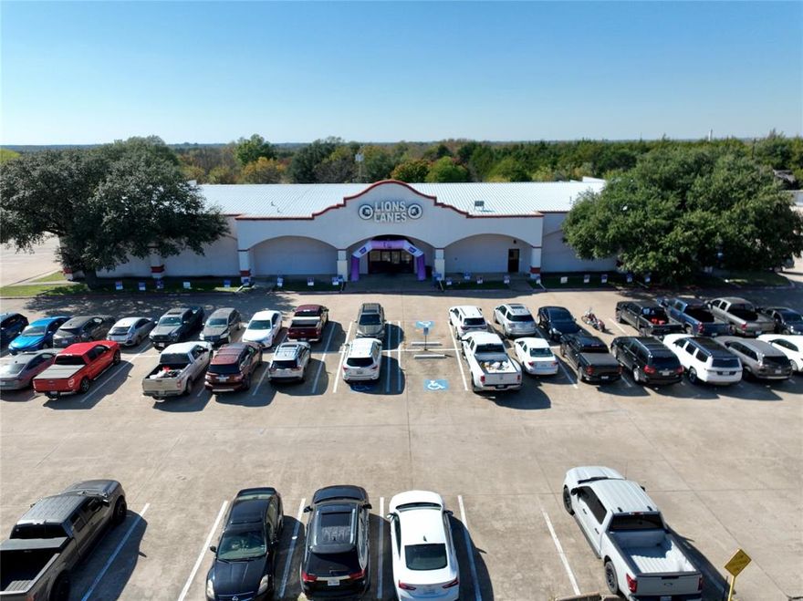 31,073 sf Commercial building situated on 2.93± acres on W. Ennis Avenue. Today's use is a 23 lane bowling alley with a laser tag zone, pool tables, a full service bar and a commercial kitchen. If the building is repurposed, it may be an attractive for retail, an entertainment venue, daycare center, a church or perhaps a temperature-controlled storage facility. The property is less than a mile from US-HWY 287 and directly across from thousands of homes in established neighborhoods. Continued development of retail and restaurants, new housing, along with industrial production is steadily drawing more attention to this area over the years, a statement on the strategic opportunity.