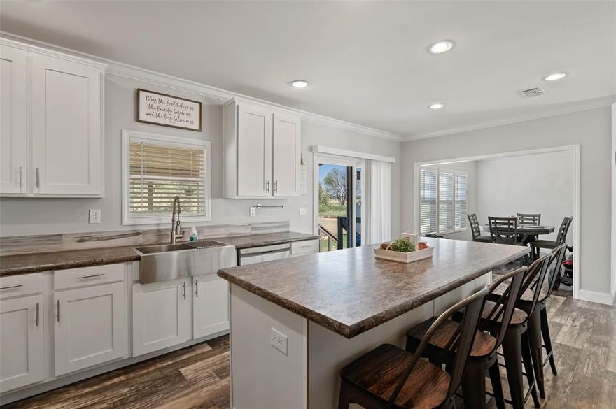 Welcome home to this beautifully appointed four-bedroom, three-bath residence set on a serene two-acre lot, offering the perfect blend of space, comfort, and country charm. This custom double-wide home features two spacious living areas and an inviting open-concept floor plan designed for both everyday living and effortless entertaining.

The expansive kitchen is a true centerpiece, showcasing stainless steel appliances, custom cabinetry, crown molding, and a striking rustic stone accent above the oven that adds warmth and character. Retreat to the private primary suite, where you’ll find a spa-like bathroom complete with a double shower and relaxing garden tub, ideal for unwinding at the end of the day.

Enjoy peaceful mornings on the front porch or host gatherings on the covered back porch added in 2021, overlooking the wide-open acreage. The property also includes a 10x16 storage building and a chicken coop, offering flexibility for hobbies, storage, or a touch of homestead living.

Ideally located just minutes from Hwy 82, shopping, and dining, this home delivers the tranquility of country living without sacrificing convenience. A rare opportunity to enjoy space, style, and functionality. Country living at its finest.