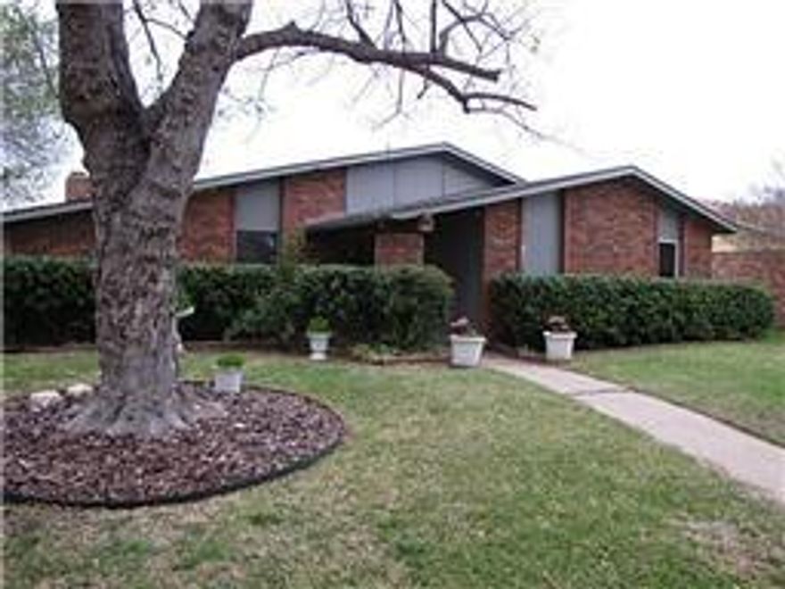 3 bedroom 2 bath with open kitchen and hardwood floors.  Large open living areas with wood burning fireplace.  Updated bathrooms and showers.  Covered porch and patio.  Plano ISD.