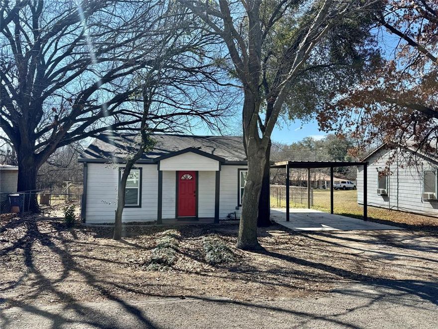 Don't Delay.  Charming and cozy home, ideally located just minutes away from Granbury's Historic Downtown Square. This delightful home has been thoughtfully updated, boasting modernized features such as new flooring, kitchen appliances, stylish butcher block counters, and an inviting bathroom. With three bedrooms, this home offers versatility; one bedroom could easily be transformed into a home office, library, or study, perfect for those who work from home or enjoy reading. The welcoming layout and inviting interiors make it suitable for a variety of lifestyles, whether you are a first-time homebuyer or an investor seeking a rental property, the possibilities are endless. The home sits on a manageable small lot, ensuring that maintenance is a breeze, allowing you more time to enjoy your surroundings. The one-car carport provides added convenience and protection for your vehicle. Situated just north of the square, this home places you within easy reach of the vibrant shopping, dining, and entertainment options that Granbury has to offer. From quaint boutiques to delightful cafes and lively events, life in this area is rich with culture and opportunity. Don’t miss out on the chance to make this updated home your own, whether as a new place to call home or as a savvy investment property that promises potential returns. Experience the best of Granbury here!