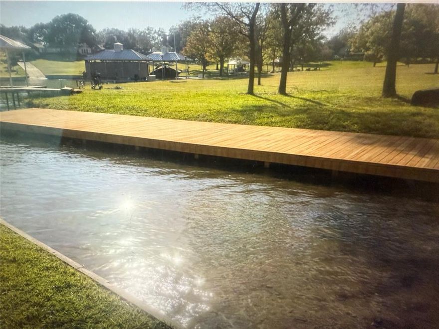 MAJOR PRICE REDUCTION!! MOTIVATED SELLERS!! 

BEACH YOUR BOAT, jet ski or kayak in this protected cove on Lake Ray Hubbard. Beautiful waterfront heavily treed lot with lake access!


Recently completed upgrades including new flooring, new quartz countertops in all baths and new plumbing fixtures. Nestled in the serene community of Lakeside Village in Rowlett, Texas, this stunning lakefront property has been freshly remodeled and offers five spacious bedrooms. The home features a large, screened patio with a spiral staircase leading up to a fantastic upper balcony deck, perfect for enjoying panoramic lake views. Enjoy meals on the lower deck with family and friends under a canopy of trees. 

Conveniently located just 18 minutes from Plano and Dallas, this home is part of the highly sought-after Rockwall ISD and offers a safe, welcoming neighborhood environment. Super close to the George Bush for easy access!

The luxurious primary bedroom offers breathtaking lake views, while the ensuite bath includes a whirlpool tub, a separate walk-in shower, and an expansive walk-in closet. The kitchen is a chef's dream, featuring recessed lighting, granite countertops, and stainless steel appliances, including a refrigerator. A custom stone fireplace serves as the focal point of the open-concept living area, creating a warm and inviting atmosphere.

Come imagine yourself sitting on the screened in patio drinking some coffee and enjoying the beautiful calm water views. You won't feel like you are in the city but at your vacation home!