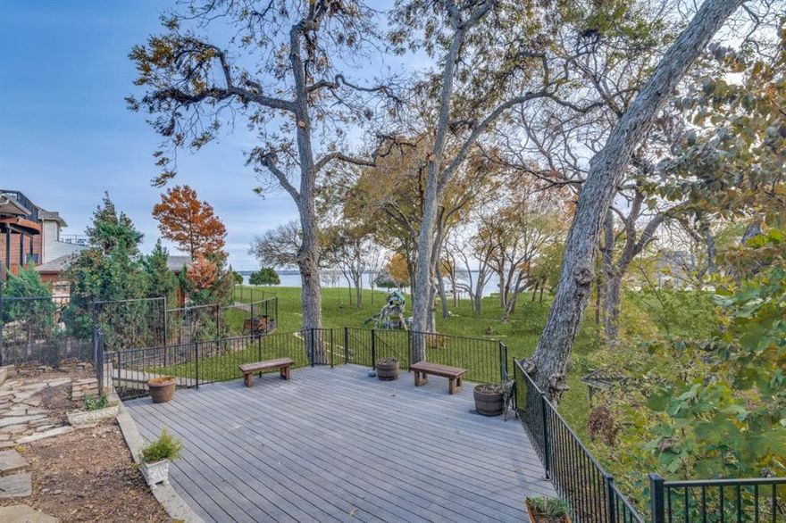MAJOR PRICE REDUCTION!! MOTIVATED SELLERS!! BRING ALL OFFERS! 

BEACH YOUR BOAT, jet ski or kayak in this protected cove on Lake Ray Hubbard. Beautiful waterfront heavily treed lot with lake access!


Recently completed upgrades including new flooring, new quartz countertops in all baths and new plumbing fixtures. Nestled in the serene community of Lakeside Village in Rowlett, Texas, this stunning lakefront property has been freshly remodeled and offers five spacious bedrooms. The home features a large, screened patio with a spiral staircase leading up to a fantastic upper balcony deck, perfect for enjoying panoramic lake views. Enjoy meals on the lower deck with family and friends under a canopy of trees. 

Conveniently located just 18 minutes from Plano and Dallas, this home is part of the highly sought-after Rockwall ISD and offers a safe, welcoming neighborhood environment. Super close to the George Bush for easy access!

The luxurious primary bedroom offers breathtaking lake views, while the ensuite bath includes a whirlpool tub, a separate walk-in shower, and an expansive walk-in closet. The kitchen is a chef's dream, featuring recessed lighting, granite countertops, and stainless steel appliances, including a refrigerator. A custom stone fireplace serves as the focal point of the open-concept living area, creating a warm and inviting atmosphere.

Come imagine yourself sitting on the screened in patio drinking some coffee and enjoying the beautiful calm water views. You won't feel like you are in the city but at your vacation home!