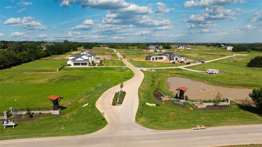 Build your dream home on this 2 acre lot in the prestigious Eagle Ridge located in Bartonville, TX. This prime lot overlooks a beautifully maintained HOA pond with a fountain, offering a serene backdrop and an elevated sense of luxury. With ideal lot dimensions to accommodate a wide range of custom floor plans, this property represents an outstanding value among the remaining opportunities in the neighborhood. 
Ideally located just minutes from Highland Village shopping and the vibrant Marty B’s entertainment district, Eagle Ridge delivers the perfect balance of peaceful living and everyday convenience. For the golf enthusiast, Denton Country Club is located just 10 minutes away. While Lantana Golf Club is located just across the street, offering convenient access to premier golf experiences. For lake-life adventure seekers, the property is ideally situated between two of DFW’s most desirable lakes—Lake Grapevine and Lake Lewisville. This lot is cleared and ready to build on with very minimal lot prep cost. The community is zoned to the highly sought-after Argyle ISD and is also minutes from Liberty Christian School. Enjoy the advantages of luxury living outside the city while maintaining easy access to major destinations—approximately 30 minutes to Dallas and Fort Worth and just 15 minutes to DFW International Airport.