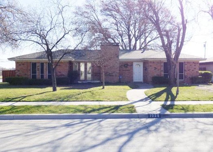 This one-story 4-bedroom, 2-bath, 2-car garage family home has 2 living areas. Located 11 miles from the 5 Billion Dollar Corridor of Frisco, it is convenient to new jobs, close proximity to a shopping mall, elementary school, restaurants, and close to highways that get you anywhere in DFW conveniently.  As a lessee, you will enjoy a home with an enclosed, rear patio, nice nice-sized shaded fenced back yard that sports a separately fenced garden area. It features a skylight & glass window and door separating the two living areas, lots of shelves, and a nook for bill processing.