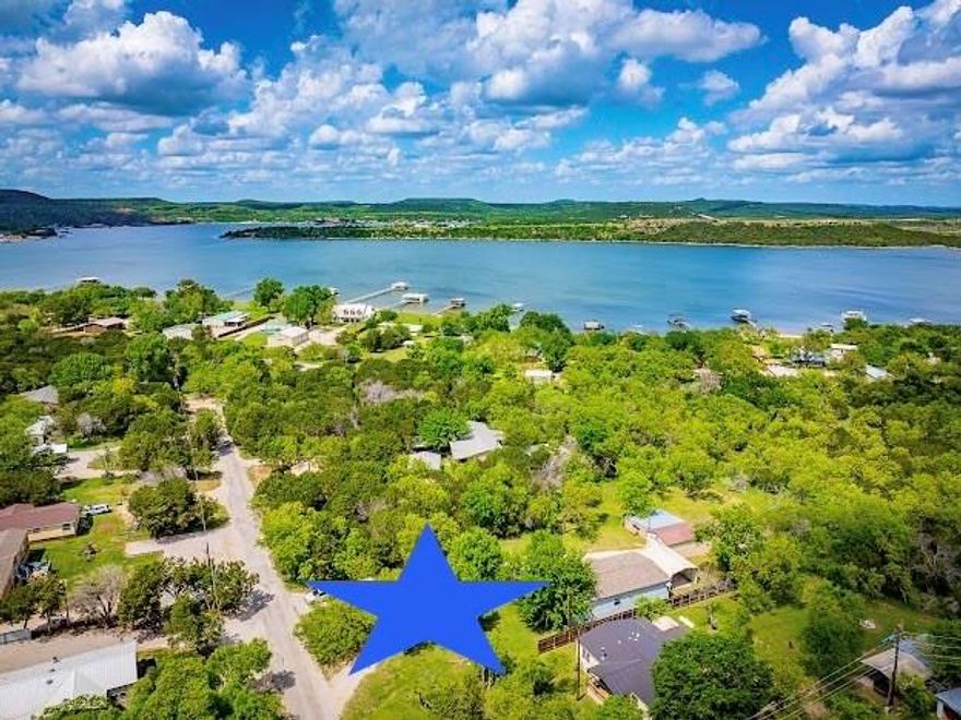 BEAUTIFUL FURNISHED 3BD, 2BA LAKEHOUSE in a PRIVATE, PARK LIKE, PK LAKE SETTING amongst Mature Shade Trees and a Large Grassy Lawn, with a Screened In Porch, 2 Car Carport, Boat Storage with automatic Door and a Workshop. This Charming 2021 Home Features an Open Concept Design with Wonderful Picture Windows throughout, a Chef's Kitchen with Stainless Appliances, Granite Counters and Eat In Kitchen Island, Spacious Living and Dining Areas for Entertaining Friends and Family, a Built in Office Space for work from Home, and a Large Laundry and Mud Room with a door to outside. All this and only .25 mile away from Boat Ramps to launch your Boat or Jet Skiis for Fantastic Lake Fun & Fishing, on Possum Kingdom Lake. This is the BEST of PK Lake Living with plenty of room to Relax and Recharge whether inside, or on the Screened Porch or outside Playing Yard Games, or sitting in the Yard just to gaze at the TX Starry Skies at night. Don't miss this one, it's a true Piece of PK Paradise, and TURN KEY READY. Can also be Overnight Rented.