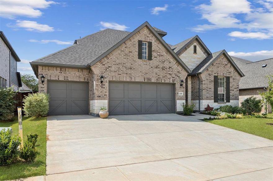 Mortgage savings may be available for buyers of this listing. Better than New! Nestled in the exclusive Reserve at Creekside, this exceptional home sits on an oversized lot framed by mature trees and tranquil scenery. With the community pool and amenities just across the street, this 4-bedroom, 3-bath residence blends both upscale living and everyday convenience. The spacious living room boasts a gorgeous stacked-stone fireplace and offers excellent indoor-outdoor flow to the oversized backyard. The large covered patio is perfect for entertaining and will no doubt become the backdrop for future gatherings. The gourmet kitchen is a showstopper, designed like a model home with double stainless-steel ovens, a gas burner cooktop, quartz countertops, 42-inch cabinetry, and on-trend hardwood flooring that flows seamlessly through the main living areas. 

The main-level primary suite is a true retreat, complete with a spa-inspired ensuite featuring granite countertops, a walk-in shower, and a large soaking tub to unwind after a long day. An adjoining flex room offers endless possibilities—ideal as a nursery, home office, gym, or even a custom dressing room to showcase your designer collection.

Tucked away on the 2nd level, you’ll find the fourth bedroom, a full bathroom, and an expansive game room, creating a versatile space that’s perfect for hosting guests, a media retreat, or an option for multi-generational living if desired.

Additional highlights include plantation shutters, energy-efficient features, a 16+ SEER HVAC system, a tankless gas water heater, and a 3-car garage professionally finished with epoxy flooring. Community amenities include a pool, jogging and biking trails, and scenic pathways throughout. Conveniently located near the Lake Lewisville Toll Bridge, I-35, UNT, TWU, and an array of dining options, this gem will not last! 3D Scan and video available online. Mortgage savings may be available for buyers of this listing.