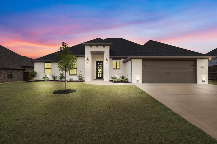 Welcome to this stunning custom-built home by Couto, featuring 4-bedroom, 3-bath residence with a designated office, offering 2,452 sq. ft. sitting on nearly a quarter-acre lot. From the moment you step through the custom iron front door, you’ll be captivated by the thoughtful design and upscale finishes throughout.

The open-concept floor plan showcases a spacious living room with picture windows, soaring ceilings accented with a beam board, and a cozy electric fireplace. Oversized doors and rich wood trim add an elevated touch in every room.

The chef’s dream kitchen is the heart of the home, featuring a massive quartz island, oversized slow close cabinetry, a two-tone custom range hood, and a seamless flow into the dining area where large windows frame peaceful country views.

Generously sized secondary bedrooms are complemented by spa-inspired baths with granite countertops, while the primary bedroom is a true sanctuary. It features tray ceilings, expansive windows, and a spa-like ensuite with dual luxury vanities, a massive dual-head shower, and a walk-in closet complete with custom shelving and a full-length mirror.

Even the utility spaces shine, with an oversized laundry room filled with natural light from its own window, along with granite countertops for added convenience and style.

Outdoor living is equally impressive with stained bead board porch ceilings, a fenced backyard, and a full sprinkler system. The oversized two-car garage with epoxy flooring completes the home with both style and function.

This property is the perfect blend of modern luxury and warm comfort—crafted for those who appreciate quality in every detail.