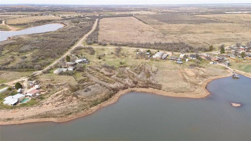 Prime lakefront lot on Lake Fort Phantom in Abilene, TX. Ready for your new home with city water and electricity available; a septic tank will be needed. Enjoy stunning views, peaceful surroundings, and outdoor activities. Enjoy the lake life to the fullest! Fort Phantom Hill Reservoir is currently at an impressive 84.6% capacity, with 59,237 acre-feet of conservation storage out of a total 70,030 acre-feet. The lake level is high right now, providing ample water for boating, fishing, and breathtaking views. Will allow modular homes, NO MANUFACTURED HOMES. Separate deed restrictions apply.