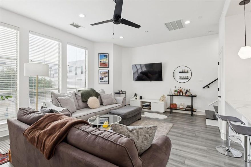 Located in a gated East Dallas community, this thoughtfully updated condo offers turnkey living with close proximity to the exciting new development along Henderson Avenue. The home features quartz countertops and soft-close cabinetry in the kitchen and all 2.5 bathrooms, complemented by waterproof laminate flooring and sleek black stainless steel Samsung appliances. Smart home upgrades include smart EcoBee thermostats, an August smart lock, myQ garage access, and LED lighting throughout. Both upstairs bathrooms showcase clean, modern tilework, and a centralized Ethernet panel provides hardwired connectivity—ideal for working from home or seamless streaming for virtual calls. The private backyard has been enhanced with a retaining wall and low-maintenance AstroTurf, creating a relaxing and private outdoor space. The property’s HOA assessment was paid in full when the current owner purchased the home two years ago, offering added long-term value. Whether you're seeking a stylish primary residence or a smart investment, this home offers strong rental potential, with consistent tenant occupancy for the past two and a half years.