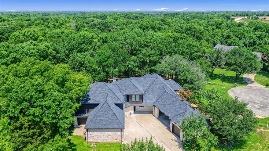 Exquisite home on a 3.2 acres with a private pond!!! New kitchen, all updated bathrooms, new hardwood flooring, new carpet, New Roof (Landmark ClimateFlex Class-4 shingles), new interior paint, natural stone in all exterior, 2 covered patios overlooking the pond. 2-stage  Trane HVAC systems and new water tanks, . Each of the bedrooms feature an ensuite bath with Master and guest suite downstairs. A library-office with built in desk, book shelves and ladder. 4 car garages and one workshop garage. Tucked away in a cul de sac quiet neighborhood yet only half a mile away from Heritage Parkway. Must see it to appreciate it!