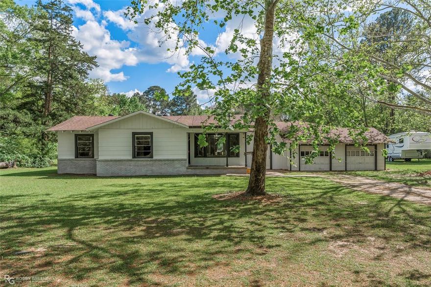 Spacious ranch-style home situated on just over 2.4 acres, offering the privacy and room to spread out you’ve been searching for! With nearly 2,400 square feet, this property features four bedrooms, one bathroom, and multiple living spaces designed for comfort and flexibility. Enjoy two separate living areas, including a second living room with a beautiful stone hearth — perfect for a cozy family room, game room, or entertaining space. The dining room features a large picture window that brings in plenty of natural light, while the eat-in kitchen offers abundant cabinet space and functionality. Outside, you’ll love the peaceful, secluded setting with plenty of acreage for outdoor activities, gardening, or simply enjoying quiet country living. Approximately a quarter acre includes access to well water, while the home is currently serviced by city water and septic. Additional features include a two-car attached garage and so much more.
If you’re looking for space, privacy, and versatility — this one checks all the boxes!