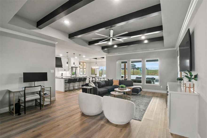 Experience the good life in the prestigious Rock Creek Resort! This top-ranked golf community features a course designed by The Jack Nicklaus Design Group. Community members enjoy exclusive amenities, including a gated entry with a guard station, private boat ramp, marina, community pool, clubhouse with a restaurant, pro golf shop, hiking trails, and more! This beautifully crafted 4-bedroom, 2-bath home offering a move-in-ready luxury experience. The open concept living, dining, and kitchen area is perfect for entertaining, with the kitchen featuring ample cabinets, an electric range, microwave, refrigerator, quartz countertops, a spacious island, and a pantry. The primary suite includes a large bedroom and a bath with dual sinks, a soaking tub, and a separate shower. With bedrooms positioned in each corner of the home, this layout offers privacy for guests or family members. The backyard boasts a covered patio overlooking the yard, a built-in flower bed, fire pit, and above-ground hot tub—ideal for relaxing and enjoying the serene surroundings. Home is available fully furnished by an interior designer, all furniture is negotiable.