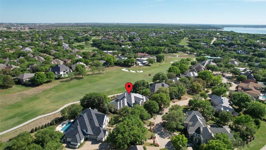 Situated on a beautifully positioned 0.45 acre lot overlooking the 10th fairway of the Mira Vista golf course, this exceptional residence offers thoughtfully designed living throughout. Featuring 5 bedrooms, 3 full baths, and 2 half baths, the home is highlighted by two primary suites, ideal for multigenerational living or hosting guests. Multiple living spaces include two spacious living areas, a gameroom with wet bar, and two dedicated offices, providing flexibility for both everyday living and entertaining. Additional amenities include an elevator, an oversized three car garage, and a resort style backyard complete with a heated pool and attached spa, all set against the backdrop of beautiful golf course views.