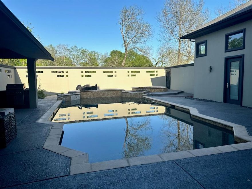 Enjoy the perfect blend of upscale comfort and tranquil country living with this exceptional custom home, set on over 29 acres.Designed with an open-concept floor plan, this residence is flooded with natural light and showcases premium finishes throughout.
Unwind or entertain in style around the stunning courtyard saltwater pool. 
Inside, elegance meets function with rich wood and tile flooring, designer lighting by Cantoni, a wine grotto, and a spacious master closet that also serves as a storm shelter. Each of the four bedrooms offers its own private balcony or patio with picturesque views—ideal for morning coffee or evening relaxation.The thoughtfully designed ensuite off the courtyard makes a perfect guest retreat or in-law suite.
The true heart of the home is the chef-inspired kitchen, featuring natural stone granite countertops, a large island, pot filler, walk-in pantry, and eat-in space. With built-in cabinetry, a butler’s pantry, and a breakfast bar, this kitchen is made for effortless entertaining and everyday living alike.
A detached garage offers generous room for your RV, boat, or additional storage. The property includes 3.6 acres within the Lost Creek neighborhood, plus 25 directly attached acres—ready for your vision, whether expansion or simply enjoying the space and privacy.