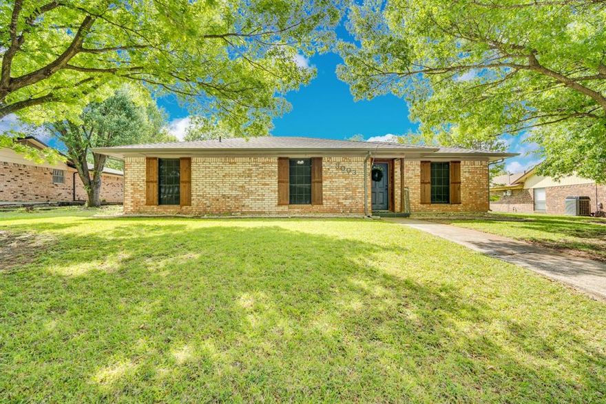 Welcome to this charming all-brick 3-bedroom, 2-bath home in Ennis, where comfort, character, and everyday living come together just 30 miles from Dallas. From the moment you arrive, you’re greeted by beautiful mature trees shading the front yard and a navy blue front door that sets a warm and inviting tone. Inside, the cozy living room is anchored by a stunning brick wood-burning fireplace—perfect for quiet evenings, gathering with friends, or simply enjoying a slower pace at home. The functional layout offers comfortable bedrooms, abundant natural light, and a welcoming flow designed for the way you live. Imagine slow mornings with coffee on the spacious open patio, afternoons spent in the large backyard on just under a quarter-acre lot, and evenings unwinding under the Texas sky—whether entertaining, gardening, or enjoying a peaceful moment outdoors. With a new roof (2021) and new HVAC system (2022), this home offers valuable updates and peace of mind. Conveniently located near parks, fishing, and the renowned bluebonnet trails, and just minutes from historic downtown Ennis for dining and shopping, with easy access to Waxahachie for even more options, this home blends small-town charm with everyday convenience—making it easy to picture your next chapter here.