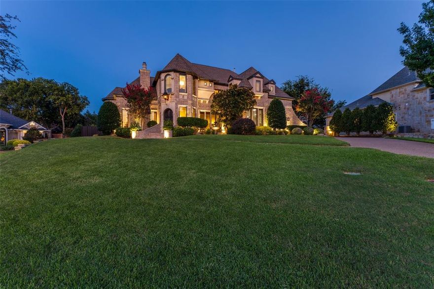Discover European influences throughout this exquisite residence, blending timeless architectural elegance with modern luxury, all within the gated Hills of Breckinridge community. Designed for refined living and effortless entertaining, it showcases exceptional craftsmanship, custom finishes, & a beautifully landscaped backyard oasis. A grand foyer welcomes you with graceful arched doorways and intricate moulding, leading into a formal living area highlighted by a cast-stone fireplace & soaring 23-foot cathedral ceiling.The private study exudes warmth and sophistication with rich wood beams & hand-scraped hardwood floors. The recently remodeled kitchen is a true showpiece—featuring custom-built cabinetry, stunning natural quartzite countertops and backsplash, and premium appliances including a built-in refrigerator, dual ovens, and gas cooktop. The adjoining family room offers a second stone fireplace and seamless access to the outdoor living area, perfect for entertaining or relaxing poolside. Upstairs, all bedrooms are thoughtfully positioned for privacy, including an oversized Primary Suite with its own sitting area and fireplace. The spa-inspired bath features a freestanding soaking tub, frameless glass shower, dual vanities, and designer lighting. Each secondary bedroom offers a refined ensuite bath with quartz countertops and modern finishes. Additional highlights include dual staircases, plantation shutters, custom draperies in designer fabrics, an upstairs utility room, and an oversized three-car garage with epoxy flooring. Outdoors, the private backyard is designed for both recreation and relaxation, complete with defined play areas, a sparkling pool, pergola, and expanded stone patio.The gated driveway enhances security and privacy.Recent updates include all windows, pool equipment, a tankless water heater, and enhanced exterior lighting & landscaping. Property is situated along the Collin–Dallas County line, offering a choice of Plano ISD or Garland ISD.
