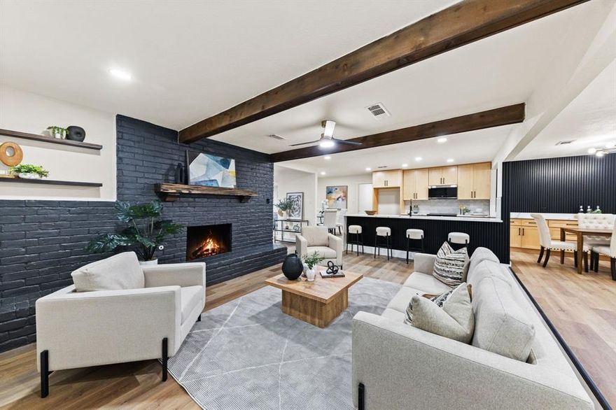 STUNNING fully renovated 3-bedroom, 3-bath, 2,086 sq ft home in a highly desirable North Bedford location! From the layout to the finishes, this open-concept, split-bedroom home has been upgraded in every way. The complete interior and exterior remodel includes a new roof, new windows, custom cabinetry throughout, LVP flooring, carpet, fresh interior and exterior paint, quartz countertops, LED recessed lighting, matte black fixtures, and more.

The large living room offers built-in shelving, cedar beams, and custom wood accents perfect for entertaining. The chef-quality kitchen features waterfall island, custom natural wood cabinetry with soft-close hinges, quartz countertops, and stainless steel appliances.

The spacious primary bedroom includes two walk-in closets and recessed lighting. The spa-worthy ensuite bathroom showcases dual vanities, custom cabinetry, quartz countertops, and a spa-inspired walk-in shower suite with a free-standing tub, multiple shower heads, wands, and a rain head. A secondary private suite offers its own oversized soaking tub. The third bedroom and fully renovated guest bath add to the home’s appeal.

The outdoor space includes mature trees and a large backyard ideal for relaxing or entertaining. Located minutes from parks, shopping, dining, and major roadways. Award-winning HEB ISD. Come see YOUR new home today!