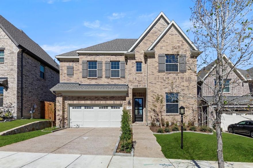 MLS# 21097159 - Built by Ashton Woods Homes - Ready Now! ~ Extended Patio! Welcome to this stunning new two-story home in Inspiration, located in the acclaimed master-planned community of St. Paul. This new home is designed with the Harmony Collection showcasing polished whites and iron finishes. Step through the welcoming foyer and discover a spacious secondary bedroom with its own private bath, conveniently connected to a storage room tucked under the staircase. On the opposite side of the main floor, you'll find a mudroom and utility area, along with a stylish powder room. At the heart of the home is a beautifully designed open-concept layout. The elegant dining room features a tray ceiling and flows seamlessly into a bright, expansive family room filled with natural light from large windows and a beautiful fireplace. Just beyond, sliding doors lead to the extended covered patio, creating the perfect space for indoor-outdoor living. The modern kitchen includes shaker-style cabinetry, a large eat-in island, and an oversized, spacious walk-in pantry, providing both beauty and function for daily living and hosting. Also on the first floor is the luxurious primary suite, offering a private retreat complete with a dual-sink vanity, a walk-in shower with mud pan, linen closet, and a generous walk-in closet. Upstairs, a lofty game room with tray ceiling creates a flexible and inviting space for entertainment or relaxation. Two additional secondary bedrooms are located on this level, each featuring its own private bathroom and