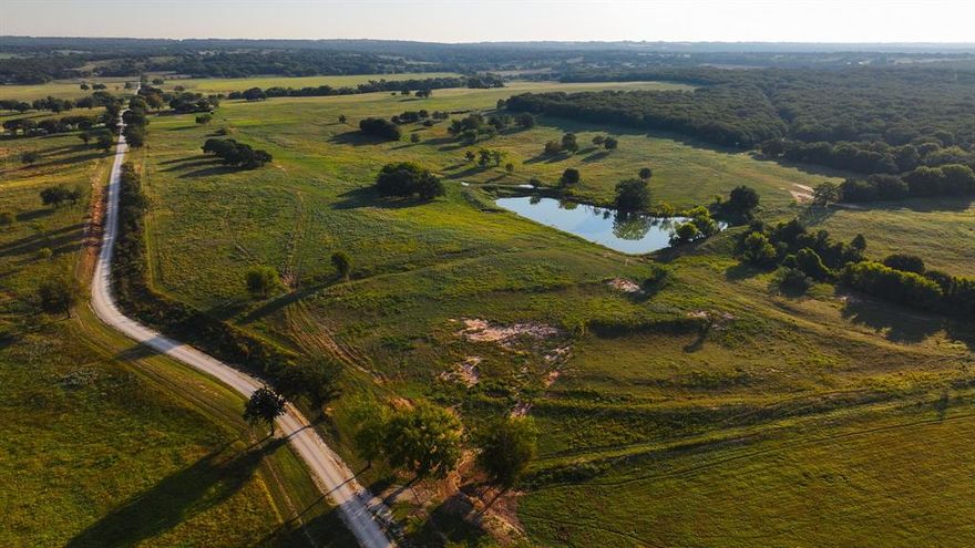 TBD Hundley Rd., Montague County, Texas. This 277-acre estate presents a rare opportunity to acquire a legacy property that combines world-class recreational habitat, premier pastureland, and creek frontage, all within striking distance of the Dallas-Fort Worth market.

Property Highlights
- Approximately 277 acres of gently rolling North Texas terrain, surrounded by large neighboring ranches and well-maintained infrastructure.
- Seven ponds
- Over 2,200 feet of Mallard Creek as it meanders through the property, offering a combination of native timber bottomlands and open pasture along the creek.
- Magnificent stands of mature post-oak trees provide a striking visual appeal, natural shade, and excellent wildlife cover.
- Broad, well-improved pasture acreage ideal for cattle operations, equestrian use, or luxury estate development with excellent perimeter and cross-fencing already in place.
- Outstanding wildlife habitat: native whitetail deer, feral pigs, and turkey are regularly observed.
- All-weather access off Hundley Road; the combination of exceptional fencing and strong neighboring landowners ensures privacy and management continuity.

Location & Access
- Approximately 100 miles northwest of Dallas (Montague County sits roughly 100 miles from Dallas) via U.S.-287, SH-59.
- 90-minute drive to the heart of the Dallas-Fort Worth Metroplex under normal conditions.
- 92 miles driving distance to DFW International Airport (DFW).
- Approximately 81 miles to downtown Fort Worth.

This offering strikes a rare balance: immediate access to the DFW market, yet framed by expansive private pasture, creek frontage, mature timber, and prolific wildlife. For the discerning buyer seeking a premier North Texas retreat, this property embodies turn-key readiness with an elite location.