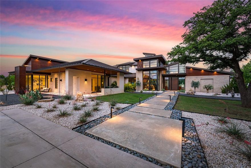 Designed by Heritage Design Studio, built by Calais, this private contemporary architectural compound is located behind a mature landscape and manicured grounds amongst the gorgeous estates along White Chapel. Set upon 5.99 acres with incredible views, a gated driveway leads to this estate of 8265-sq ft. Built for the most refined of tastes. Step inside to find an expertly curated interior with sweeping views, and glass sliders opening to several outdoor lounge areas. A modern chef's kitchen has it all including a large island with White Pearl quartzite waterfall counters. A spacious primary suite with its own laundry room, private courtyard, and resort inspired bath provides optimal space for relaxation. Outside you'll find sprawling grounds with outdoor kitchen, pool with spa, outdoor lighting and fountains. Detached office and workshop with additional garage complete this estate. Complimentary designed buildings 1302-sq ft office and workshop-garage complete the residence.