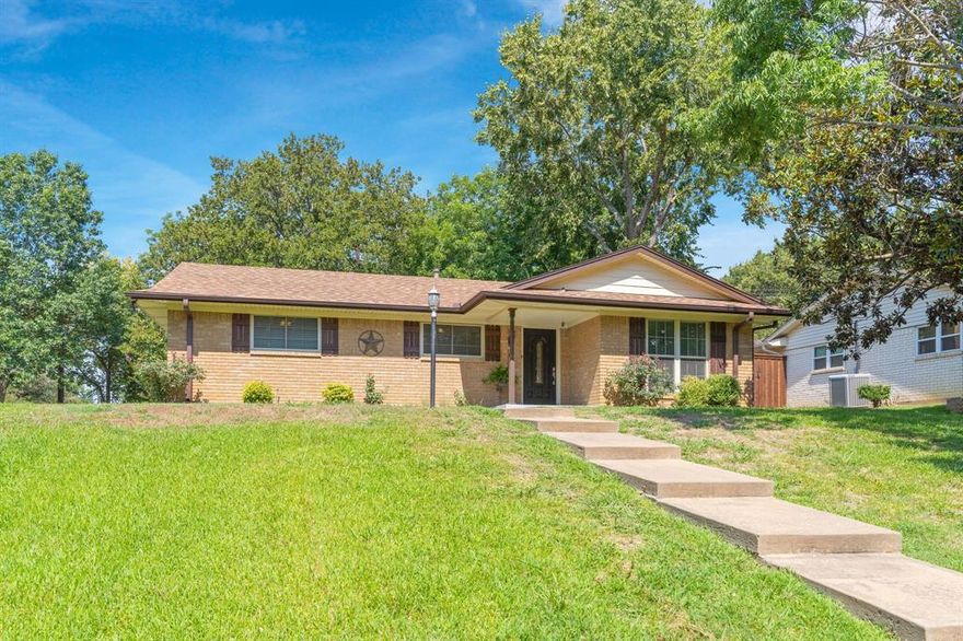 Look no further, this Texas Ranch on a large corner lot is move in ready! Conveniently to Highway 75, Waterloo Lake, TMC and Katy Trail. This charming 3 bedroom and 2 bath home has a bonus room that could be a second living or a study, and the large family room offers a wood burning fireplace. The spacious kitchen and eating area boast several updates including granite counter tops and fresh paint . Outside you are surrounded by a large front yard with a covered side patio and the back yard is fenced with a deck area. The home has numerous updates including paint, tile in bath, roof in 2019 and Foundation Repairs in 2022 & 2023 with transferable warranty. Don't miss your chance to live in Green Acres!