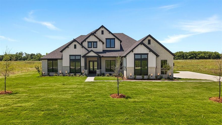 Welcome to Levante! This stunning John Houston new construction home offers 3,139 sq. ft. of beautifully designed living space on a gorgeous 1 acre lot, with luxury finishes and thoughtful upgrades throughout. From the moment you walk in through the double front doors, you’ll love the open layout, soaring feel, and attention to detail this home provides. This thoughtfully designed 4-bedroom, 3-bath home includes a dedicated office and versatile flex space that could easily function as a game room, media room, playroom, or second living area — giving everyone space to live, work, and entertain comfortably. The spacious living room features stunning vaulted ceilings, a cozy gas fireplace, and flows seamlessly into the chef’s kitchen complete with floor-to-ceiling custom cabinetry, gorgeous windows for natural light, custom built-ins, and designer finishes throughout. Wood-look tile flooring runs throughout the main living spaces, creating both elegance and durability. The private primary suite is a true retreat with vaulted ceilings and a spa-like bath featuring a freestanding soaking tub, rain head shower, dual vanities, and elevated custom touches. Additional upgrades include a tankless water heater, custom cabinetry in the dining area, and luxury details throughout the home. Situated on a beautiful lot in the sought-after Levante community and zoned to Waxahachie ISD, this move-in ready home perfectly blends luxury, comfort, and modern functionality — ready for someone to make it their dream home.