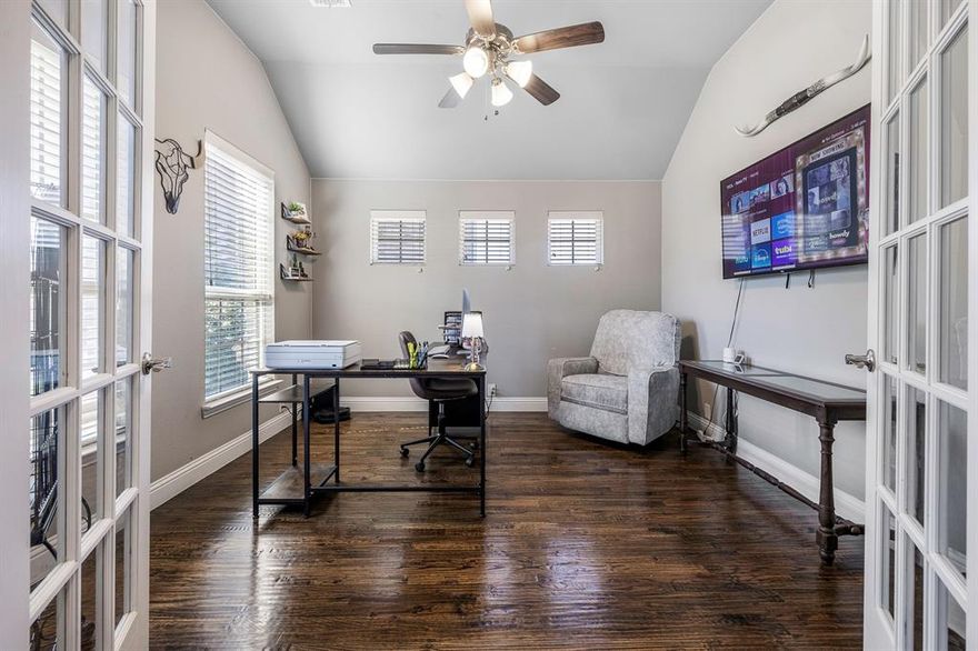 If you’ve been searching for a home that feels comfortable, functional, and easy to settle into, this one offers a layout and design that just makes sense from the moment you walk in.

Located in The Parks at Willow Ridge, a sought-after Haslet community, this 3-bedroom, 2-bathroom home with a dedicated flex space provides a thoughtful balance of openness and defined living areas, creating a layout that feels both connected and practical for everyday living. Inside, hand scraped hardwood floors, vaulted ceilings, and abundant natural light create a bright and inviting atmosphere throughout the main living spaces. The living room features a fireplace with custom mantle detail, offering a natural focal point and a comfortable place to gather or unwind. The kitchen opens to the living and dining areas, providing a seamless flow that supports both daily routines and entertaining. With ample cabinet storage and generous counter space, along with a layout designed for efficiency, the kitchen is both functional and easy to use. A separate flex space with double French doors adds valuable versatility and privacy, making it ideal for a home office, additional living area, or a space that can adapt over time to meet changing needs. The primary suite offers a spacious and private retreat with an en suite bathroom that includes dual vanities, a soaking tub, and a separate shower. Secondary bedrooms are well sized and thoughtfully positioned to provide flexibility and comfort for a variety of uses. Out back, the covered patio creates a place to relax, while the above ground pool and large fenced yard offer space to entertain, enjoy the outdoors, or simply spread out. A storage shed provides added convenience for tools or storage. With its efficient layout, comfortable flow, and well-balanced use of space, this home offers a living experience that feels both practical and inviting, making it easy to enjoy from day one. A space ready to be lived in, enjoyed, and made your own.