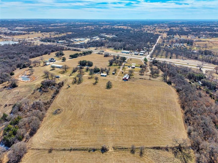 Prime acreage opportunity in Millsap ISD, with a Weatherford address, ideally located near the Parker County Posse Grounds and just minutes from Weatherford’s city center for premier shopping, dining, and entertainment. This Ag-exempt property offers exceptional privacy with convenient highway access, making it highly desirable for both end users and future development. The land features valuable existing improvements, including multiple wells, septic systems, a barn, and outbuildings, providing immediate utility and flexibility. The property is mostly fenced, and a brand-new survey is available, offering confidence and clarity for buyers. With commercial use allowed and a highly accessible location, this property presents strong potential for investors, developers, or business owners, while also appealing to those seeking a private estate-style setting with infrastructure already in place. A rare opportunity combining location, privacy, versatility, and long-term value in Parker County.