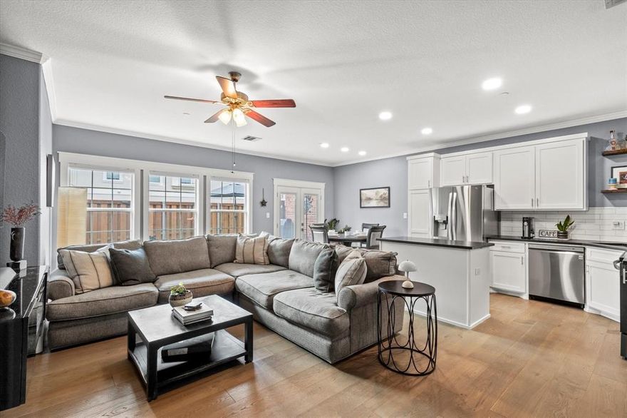 Property financing incentive offered through a preferred lender of up to 1%.  Ask Agent for more details! Over $55K in Updates since 2022! Welcome to this stunning, fully updated end-unit townhome ideally located just minutes from Watters Creek, Fairview Town Center, and the Allen Premium Outlets. Highlighting a thoughtfully designed floor plan, this modern home combines style, comfort, and convenience. Step inside to discover a spacious open-concept layout adorned with gorgeous engineered hardwood floors and a soothing neutral color palette. The inviting living room showcases a striking electric fireplace set within a wood-trimmed accent feature — the perfect setting for cozy evenings or entertaining guests. Utilize your culinary skills in the fully updated kitchen equipped with Birch wood cabinetry with soft-close drawers, leathered granite counter-tops, island, and sleek LG stainless steel appliances. Enjoy casual meals or elegant dinner parties in the dining room which effortlessly flows into the kitchen and living room. Make your way to the second floor where you'll find a wonderful flex space that could be a perfect work from home space or reading area. The split primary suite offers privacy and luxury with an updated spa inspired bath featuring dual sinks with Quartz counter-tops, a freestanding soaking tub, modern shower with a rainfall showerhead and handheld wand, and a generous walk-in closet. Two additional bedrooms share a well appointed full bath, and a convenient upstairs laundry room adds to the home's thoughtful design. Enjoy your morning coffee, grilling or unwinding in your private fenced yard, backing to a greenbelt and just a short walk to the community pool and nearby Bark Yard Dog Park.