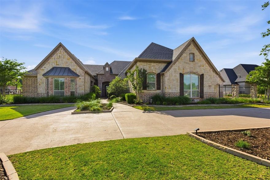 Stunning custom one-story ranch-style estate situated on a sprawling .74-acre lot in the highly sought-after Whispering Meadows community. Exceptional curb appeal welcomes you with a private courtyard featuring a covered sitting area and cozy fireplace—perfect for entertaining or relaxing.

Inside, you’ll find a beautifully designed open-concept floor plan with high-end finishes throughout, including a wine room with refrigerators, sink, and custom built-ins. The gourmet kitchen is a chef’s dream, equipped with Wolf stainless steel appliances, built-in Sub-Zero refrigerator, oversized island with seating, designer backsplash, and an expansive walk-in pantry.

The kitchen flows seamlessly into the breakfast area and spacious living room, highlighted by vaulted cedar beam ceilings, a fireplace, and walls of windows providing natural light and backyard views.

Private study with built-ins and its own fireplace. The luxurious primary suite features a sitting area and bonus room ideal for a gym, nursery, or office. Spa-inspired bath includes soaking tub, oversized shower, dual vanities, and custom walk-in closets.

Media room and game room with courtyard access. Secondary bedrooms are generously sized with ensuite baths for privacy.

Resort-style backyard with heated pool, firepit, covered patio, built-in grill, outdoor refrigerator, putting green, and ample green space.

Additional features include a utility room with mudroom and washing station, oversized 4-car garage with storage and workspace, and oversized attic (“Texas basement”).