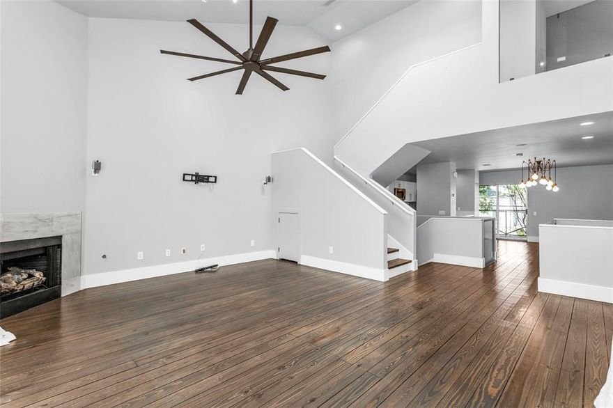 Welcome to a gated Oak Lawn townhome that offers a privacy, luxury, and a touch of urban edge. This 3 story corner unit features a spacious private yard, 2 car garage, and thoughtful upgrades throughout. Entertaining starts on the second level with soaring vaulted ceilings anchored by a marble gas fireplace which flows effortlessly into a designer kitchen with solid surface countertops and a white marble backsplash. Hardwood floors with intentional aged detailing give the space character, while a balcony off the dining area offers the perfect spot for morning coffee. The 1st floor offers a well appointed bedroom with an ensuite bath and flex space to also include a home office as well as direct access to the private yard. The top floor primary suite feels like a boutique hotel as soon as you step through a dramatic oversized glass barn door and take in the fabulousness of the designer molding, accent wall with Jonathan Adler sconces, and a custom walk in closet with built in, remote controlled lighting and space for secured storage. The spa like bathroom is bright and white and features dual shower heads and separate soaking tub. Additional upgrades include a high end security system with cameras and dual alarm panels; one on the third floor for full control, even from bed. Enjoy the walkability to Cedar Springs, Turtle Creek, and the Katy Trail, plus quick access to Love Field, Uptown, and Downtown. With its unbeatable location, rare yard space, and elevated finishes, this home checks all the boxes for a stylish, low maintenance Dallas lifestyle. 

**There is a current lease in place through August 31st 2026, but flexible with vacating at the end of the lease or extending another year.