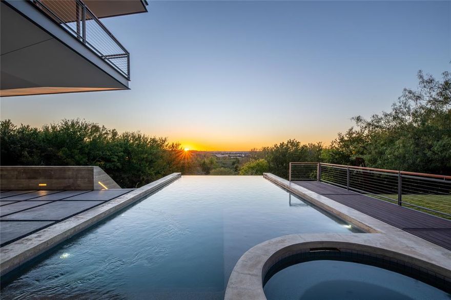 An Icon, Reimagined. Welcome to 3736 Aviemore Drive, a striking expression of modern architecture defined by precision, innovation, and refined living. Sculptural lines and rare materials converge to create a residence that is truly one of a kind in the region. The exterior makes an immediate statement, blending clean geometry with warmth through Quantum windows and doors, Accoya and Sapele wood accents, and a thoughtfully layered material palette. The main level is designed for effortless daily living, featuring four en suite bedrooms alongside the primary living spaces. Expansive accordion doors open seamlessly to an elevated outdoor terrace, extending the living area into the treetops and framing panoramic views and unforgettable Fort Worth sunsets. Thoughtfully designed indoor and outdoor staircases create a fluid connection between levels, while a private elevator provides seamless mobility throughout the home. The lower level offers a second living and entertaining space, with accordion doors opening to an expansive outdoor entertainment area—ideal for hosting and relaxed gatherings alike. Inside, the home unfolds with a gallery-like flow anchored by a Bulthaup kitchen appointed with Gaggenau appliances and Miele refrigeration. European oak flooring, Starfire glass, and exceptional craftsmanship are evident throughout, from Dornbracht fixtures to custom Drophouse fireplaces. Amenities include a concealed 1,200-bottle wine room, private theater, and a wellness suite with sauna, complemented by over 2,900 square feet of covered outdoor terrace and patio entertaining space. Smart home features include Control4 automation, Lutron lighting and shades, heated floors, and integrated displays throughout. Thoughtfully refreshed and returning to market with a renewed presence, this extraordinary residence is curated for the utmost luxury, convenience, and accessibility—offering features unseen in Fort Worth history and standing as a true architectural masterpiece.