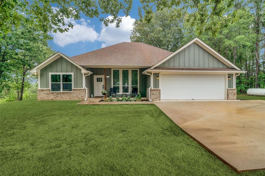 Welcome to 11302 CR 4012 in Lindale—a rare opportunity to own a meticulously maintained custom home on 2.95 acres in the highly sought-after, gated Lake Shiloh Estates community, just outside city limits. This stunning 4-bedroom home offers the perfect blend of comfort, privacy, and functionality and is located within the desirable Lindale ISD, making it an excellent choice for those seeking strong local schools. Surrounded by mature trees on both sides, the property delivers a true “fortress of solitude” feel, creating a peaceful retreat from the everyday hustle—while still enjoying the added security and exclusivity of a gated neighborhood. Step outside and experience your own private backyard oasis, complete with a stocked pond full of bass and other fish—ideal for relaxing afternoons or casting a line just steps from your door. For those who need space to work and play, the impressive 30x36 shop is built with a 6-inch slab designed to accommodate heavy equipment, making it perfect for projects, storage, or hobbies. There’s also dedicated RV parking behind the home, featuring a 50-amp hookup and its own septic drop for ultimate convenience. Preparedness meets peace of mind with a Generac whole-home generator powered by its own propane source—ensuring you’ll never be left in the dark, no matter what the grid is doing. When it’s time to unwind, indulge in the luxury of the Michael Phelps Signature Swim Spa, offering premium, year-round hydrotherapy right in your backyard. Adding even more value, the property benefits from a wildlife management tax exemption, offering a valuable property tax break while supporting the preservation of native habitat—an attractive advantage for both your lifestyle and your long-term investment. Properties with this level of care, amenities, acreage, privacy, location, and financial benefit rarely come to market. This is truly a must-see—schedule your private tour today and experience everything this exceptional property has to offer.
