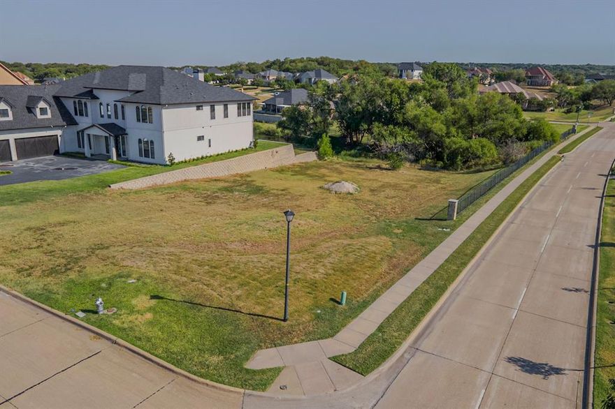 .5-acre corner lot with a picturesque view in the scenic Lake Ridge Community! Bring your own builder and build your dream home. No time limit to start building. You'll be a few streets from Wildwood Park and the Lake Ridge Clubhouse. The neighborhood also features Tangle Ridge Golf Course, an 18-hole championship golf course and Valley Ridge Park. This park has a stocked fishing pond with a pier, 1.5 mile paved trail, playgrounds, and sports fields. Other amenities include multiple parks with ponds, walking trails, and playgrounds within the neighborhood. You'll be minutes from Joe Pool Lake, Lynn Creek Marina, and Cedar Hill State Park. 30 to 45 minutes to downtown Dallas, Ft. Worth, DFW Airport, A&T Stadium, Globe Life Park, and Texas Live. Don't miss this chance to create your own oasis in this sought-after neighborhood.