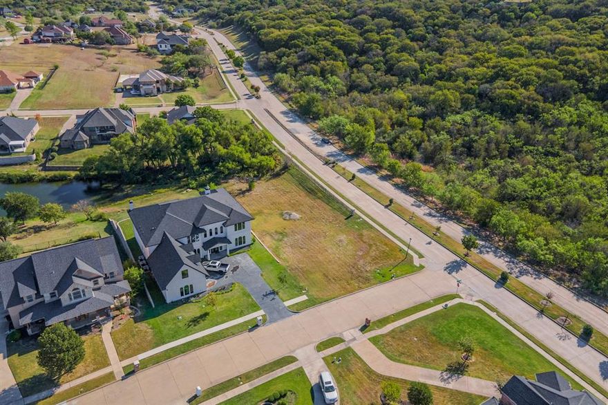 .5-acre corner lot with a picturesque view in the scenic Lake Ridge Community! Bring your own builder and build your dream home. No time limit to start building. You'll be a few streets from Wildwood Park and the Lake Ridge Clubhouse. The neighborhood also features Tangle Ridge Golf Course, an 18-hole championship golf course and Valley Ridge Park. This park has a stocked fishing pond with a pier, 1.5 mile paved trail, playgrounds, and sports fields. Other amenities include multiple parks with ponds, walking trails, and playgrounds within the neighborhood. You'll be minutes from Joe Pool Lake, Lynn Creek Marina, and Cedar Hill State Park. 30 to 45 minutes to downtown Dallas, Ft. Worth, DFW Airport, A&T Stadium, Globe Life Park, and Texas Live. Don't miss this chance to create your own oasis in this sought-after neighborhood.