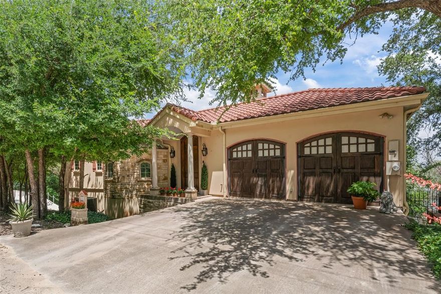 Escape to the Lake—A Mediterranean-Inspired Retreat on Open Water
Welcome to this custom-built gem nestled on the main body of Lake Granbury in the exclusive community of River Ridge. This 3-bedroom, 2.5-bath home blends timeless architecture with rare lakeside luxury—offering not only sweeping water views but also private dock ownership with a boat lift, a privilege few lake homes in Texas can claim.

From your own backyard staircase, step directly to the water’s edge and onto your private dock—perfect for boating, fishing, or simply enjoying quiet mornings by the lake. This is lakeside living at its finest, with unobstructed access to the main body and panoramic views that stretch for miles.

The exterior showcases classic Mediterranean charm with a tile roof, stucco and stone façade, and a distinctive stone turret that gives the home unforgettable curb appeal. Inside, an oak staircase winds upward within the turret, setting a warm and dramatic tone the moment you enter. Natural light fills the open-concept living and dining areas, where sweeping views carry throughout the home. An island kitchen offers ample prep space and flows effortlessly to the covered al fresco dining terrace, perfect for lakeside entertaining.

Upstairs, the primary suite and guest bedrooms each open to outdoor balconies, creating peaceful vantage points for sunset skies and morning breezes. The oversized garage is wired for an electric vehicle and includes extra room for lake gear and storage.

Future-ready design includes pre-installed plumbing, drainage, and electric in the downstairs family room—perfect for creating an independent suite for guests or extended family.

Ideally located just minutes from Granbury’s charming downtown, whether you’re looking for a forever home or a weekend escape, this property offers the perfect blend of comfort, character and possibility. This is where timeless beauty meets lakefront living. View it today, call it home tomorrow!