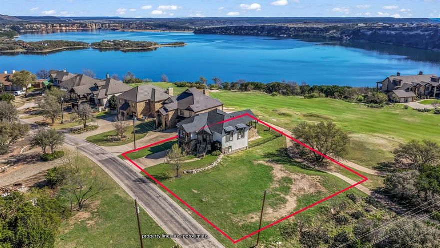 Enjoy spectacular lake and golf course views from this 5 bedroom 3 bath home located at The Cliffs Resort on the 11th fairway at Possum Kingdom Lake! This property has been extensively remodeled and seamlessly decorated for a luxurious lake ambiance. The open concept living area is the heart of the home with large windows lining the back wall and plenty of seating for large groups in the dedicated dining and breakfast bar area.  Spacious outdoor living area with built in grill is a year round favorite for entertaining or just unwinding with unforgettable sunsets.  Elegant fencing lines the back part of the house to secure dogs and young children.  Oversized garage. This PK Lake Home is a  perfect blend of comfort and style and is ideal as a full-time residence or a luxury lake escape. BONUS ONE: The seller has a coveted 14' x 30' boat slip on the B dock at the Cliffs that is transferrable to the new owner.  The waiting list for one of these can be up to years.  BONUS TWO: the .22 acre lot next to the house is owned by the seller and is part of the sale of this home as a multiparcel listing. Very few homes at the Cliffs have any extra space next to them. BONUS THREE: Fully Furnished, Turn Key Home at agreed upon selling price. Kitchen is fully equipped and appliances, roof, and light fixtures are all new within the past 4 years.  Owners enjoy access to premier amenities including marina and beach access, two pools, tennis courts, pickle ball, dining at the Chaparral Grille overlooking stunning Morris Sheppard Dam, world class golf course, fitness facilities, and 24-7 gated security.  Spring is a great time to come out and take a tour as the 4th of July Hells Gate fireworks show is just around the corner!