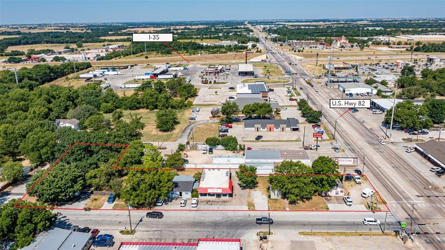 INVESTORS here's your chance to grab an acre of multi-use commercial property in a HIGH TRAFFIC LOCATION on Hwy 82 in Gainesville just seconds from I-35! With ROAD FRONTAGE ON 4 SIDES (Hwy 82, Culberson Street, Yates and Mill Street), this is a tremendous investment and development opportunity with great visibility and easy access from main roads and intersections. Located in a thriving and fast growing area, this property offers a well established laundromat that's been in business for over 35 years, 3 houses being leased, a vacant lot, an office building and a large 30 foot advertising billboard on the corner of Hwy 82 and Culberson Street. The laundromat is owner occupied and operated and the other parcels are all being leased providing a nice income. Currently the owner is only utilizing half of the laundromat building so the other half could easily be leased out for another business. On the Southwest end of the property is a large vacant lot ready to develop to your desire. LOCATION, LOCATION, LOCATION....don't let this one pass you by!