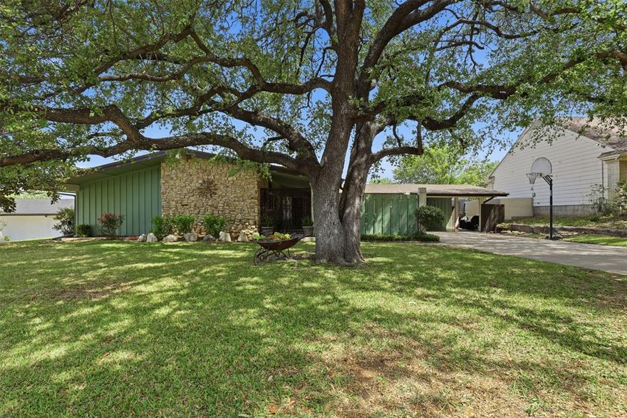 Tucked into the highly sought-after Wedgwood neighborhood, this mid-century modern home offers character, functionality, and views you won’t find just anywhere. The backyard delivers a rare perspective of the TCU football stadium alongside the Fort Worth skyline—an incredible setting for relaxing evenings. A private front courtyard welcomes you in, complete with a covered porch and hot tub for year-round enjoyment. Inside, the kitchen steals the show with a vintage Chambers gas cooktop, famously built to last, featuring a hidden griddle and broiler beneath a lift-up wood work surface. The home includes 4 bedrooms, 2 bathrooms, plus a flexible office or sitting room. Recent updates bring peace of mind with windows replaced in 2024, a new roof and gutters in 2025, and new HVAC in 2020. The attached carport includes a workshop with electricity for hobbies or extra workspace. Additional storage is thoughtfully built above the carport, along with two storage sheds in the backyard. The layout offers a blend of mid-century style and everyday livability. All of this in a mature, tree-lined community known for its charm and central location. Homes like this with personality, updates, and views don’t come around often.