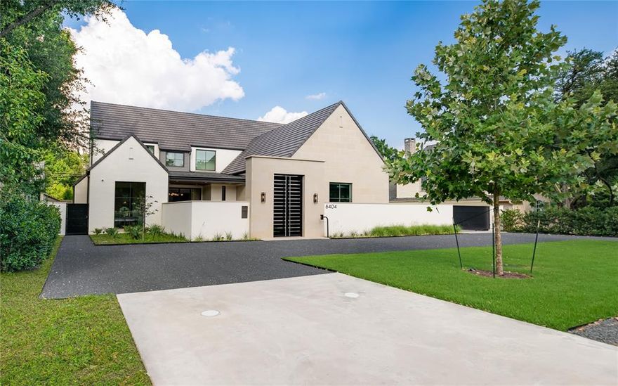 This exceptional 5-bedroom, 5.3-bath estate spans 7,602 square feet of artfully crafted luxury. Conceived by David Stocker of SHM Architects and brought to life by Faulkner Perrin, the home is gracefully set on a half-acre in Bluffview—a Dallas enclave celebrated for its rolling hills, mature trees, and distinctive topography. A gated courtyard introduces interiors defined by layered textures, clean lines, and masterful detail. Formal and casual spaces alike are enriched by four fireplaces, with an effortless flow that encourages gathering and quiet retreat in equal measure. The kitchen and adjoining prep kitchen are outfitted with professional appliances and custom cabinetry. A sleek bar and climate-controlled wine room enhance the home’s entertaining appeal, while the loggia with motorized screens, outdoor kitchen, and manicured grounds invite year-round outdoor living. Built for the modern lifestyle, the home includes a private office, game room, media room, sauna, and dog spa. Three laundry areas, a mudroom, tornado safe room, and a spacious three-car garage round out the practical luxuries woven throughout the design. The primary suite is a tranquil haven with spa-inspired finishes, custom fixtures, and scenic backyard views. All secondary bedrooms offer private en-suite baths, ensuring personal space and comfort for family or guests. Positioned near Love Field, Preston Center, NorthPark, and top private schools, this Bluffview estate offers an unmatched combination of location, lifestyle, and timeless sophistication.