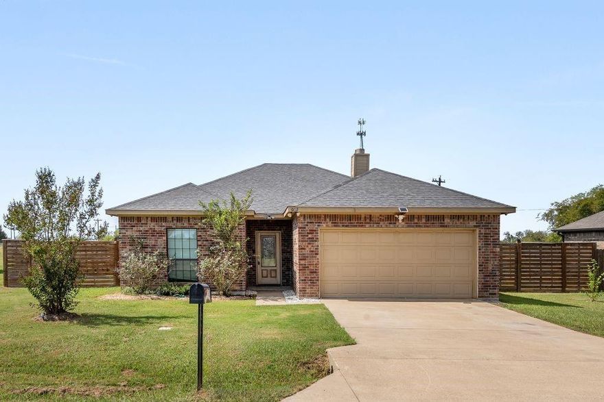 Welcome home to 1002 Baker Lane in beautiful Mabank, TX, known for its close proximity to Cedar Creek Reservoir. Here you will find the best of both worlds from the charm of peaceful country living to the everyday convenience of being within minutes of shopping, schools and the local Starbucks. Step inside to find a spacious 3-bedroom, 2-bath home with an open concept layout, featuring stainless steel appliances with a new stove (May 2025), freshly custom-painted walls, ceilings and front door and a fireplace in the living room. Outdoors, enjoy the expansive large backyard, perfect for relaxing or entertaining, complete with new landscaping (August 2025) and surrounded by a custom-built wood privacy fence complete with 3 access points(1 walk-through and 2 drive-through). The freshly re-stained back deck with new color changing deck lights (9 colors installed in August 2025) is the perfect spot to unwind. Whether you’re looking for a weekend escape or a full-time retreat, this move-in-ready home nestled on a dead-end street, is your chance to enjoy the quiet of the country—without giving up the comforts of town.