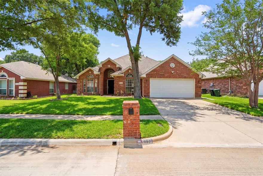 Welcome to this beautifully designed 4-bedroom, 3-bathroom home nestled in a quiet, established Arlington neighborhood surrounded by mature trees and natural charm. This open-concept layout offers a seamless flow between the living, dining, and kitchen areas—perfect for both everyday living and entertaining. The spacious living room features a cozy fireplace, creating a warm and inviting focal point.The recent updates allow you to immediately move in and make it your own!

Step outside to enjoy the covered back patio, ideal for relaxing or hosting gatherings year-round. The community is known for its scenic walking trails where peacocks are often spotted, adding a unique and peaceful touch to your daily routine.

Conveniently located near shopping, dining, and major highways, this home combines tranquility with accessibility. Don’t miss the opportunity to make this inviting property your own.