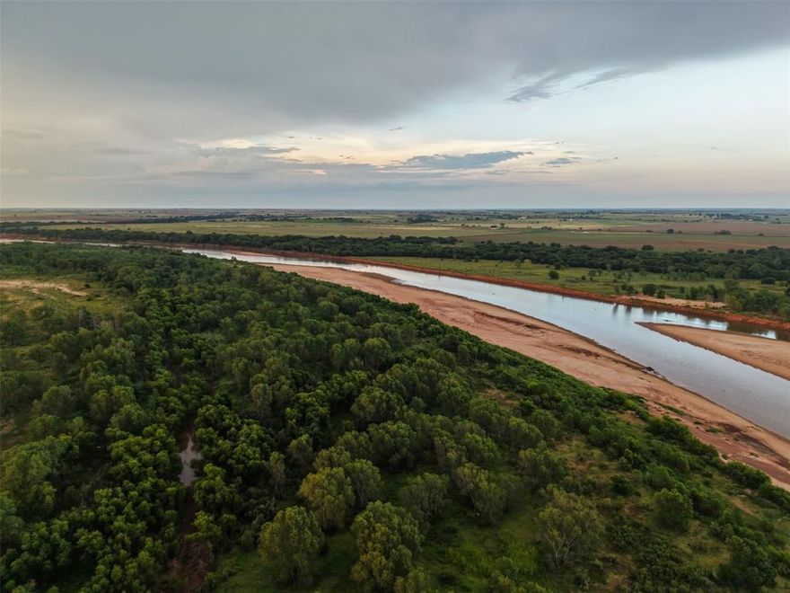 Rare opportunity to own an exceptional large-acreage recreational ranch with an impressive 1.5 miles of Red River frontage with acreage in both TX and OK in contiguous parcels on the west side of the river.  With limited infrastructure and improvements for a ranch of this size, you can enjoy the benefit and beauty of natural resources while having the freedom to shape this property as your own.  *Seller willing to subdivide into 3 tracts - contact Listing Agent for details*

The expansive River Bluff Ranch offers an array of possibilities for future use including a family ranch or personal residence, a weekend getaway, or even income production from hunting leases or package hunts.  The diverse terrain of this riverside ranch includes dense tree cover, river bottomland, and wetlands that create excellent wildlife habitat.  It also offers areas of fertile soils for cultivation, seasonal creeks running through much of the property, and good surface water including several ponds. 

River Bluff Ranch offers top tier recreational options for hunting, fishing, and trail riding for ATV or horseback with over 10 miles of trails throughout the property.  While lightly hunted in recent years, River Bluff Ranch produces trophy whitetail and year-round action with turkey, hog, duck and varmint hunting.  The bends of the river offer multiple spots to fish for channel catfish, flathead, sand bass, and more.  The ranch is also fenced for cattle, with the fencing in good condition, and a set of working pens onsite.  A 3-sided livestock shed with pipe fencing is adjacent to the lodge.
A 3284 sqft 2BR 2.5B lodge building provides a comfortable space to gather, relax and rest.  A separate 2BR 1B cabin with kitchen and a covered front porch offers additional living space for guests.  The ranch has co-op water and electricity connected.  Ag exemption in place.  No minerals owned.

This listing is co-brokered with Turner Land Company.