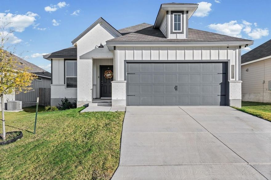 Built in 2024, this 3-bedroom, 2-bath home at 117 University Avenue in Troy’s Village at Elm Creek is better than new, offering all the convenience of a fresh build with thoughtful upgrades already in place. The open layout begins with a welcoming foyer and flows into a bright kitchen and living space designed for both everyday comfort and entertaining. The kitchen features stainless steel appliances, an upgraded tile backsplash, under-cabinet lighting added by the seller, and ample counter space that connects seamlessly to the dining and living areas.

The spacious primary suite includes room for a sitting nook, a dual vanity bathroom with an upgraded walk-in shower, and a massive walk-in closet. Two additional bedrooms and a full bath provide space for family, guests, or a home office.

The seller has also added a garage door opener and a pet-friendly doggy door, making this home both functional and family-ready. Throughout the home you’ll find full blinds, with built-in blinds in the back door for convenience. Outside, fresh flower beds highlight the curb appeal, while the front, rear, and side sprinklers keep the yard effortlessly maintained. A security system will also convey with the property, offering peace of mind from day one.

Just minutes from I-35, this home places you 15 minutes from Temple, 30 minutes from Belton Lake, and within the highly rated Troy ISD. Offering small-town charm and modern comfort, this property is move-in ready and waiting for its next chapter.