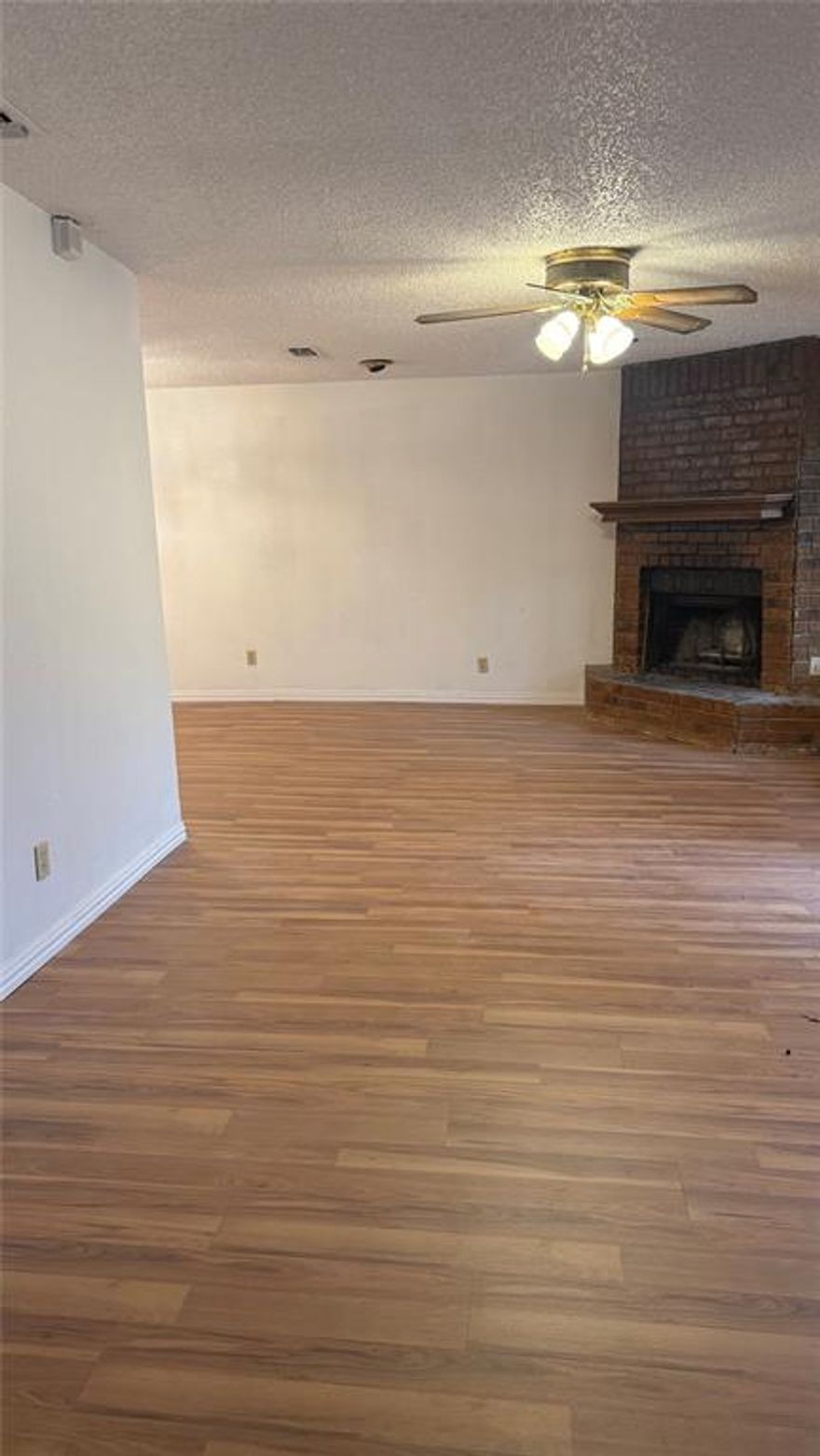 Charming 3-Bed, 2-Bath Home Full of Potential! Come see this spacious 3-bedroom, 2-bath home with over 2200 square feet of living space! The split-bedroom floor plan offers extra privacy and flexibility for any lifestyle. You'll love the main living room with a cozy fireplace—perfect for relaxing. There’s also a second living area with a bar and a second fireplace, giving you a great space for movie nights, games, or entertaining. The home could use a few updates, but it has so much character and is ready for your personal touch. Whether you want to make small changes or do a full makeover, this home is a great starting point. With solid bones and tons of charm, this is your chance to create something truly special. Don’t miss it—schedule your showing today!