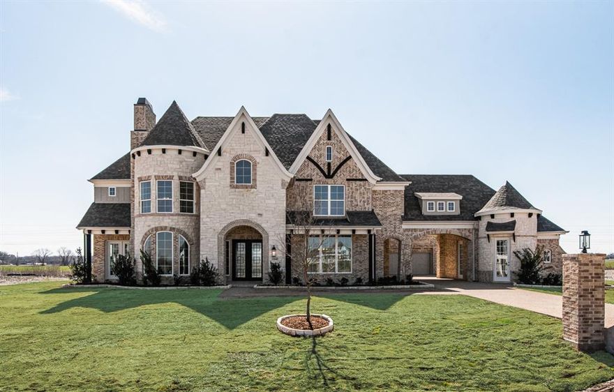 Spectacular Grand Home offers unrivaled elegance & charm, set on a spacious north-facing Acre homesite with a 4 Car Garage & Port Cochere driveway. Upon arrival, you’re greeted by double front doors and a striking dual staircase, all complemented by beautiful wood flooring throughout. The expansive Family Room boasts soaring ceilings, a dramatic two-story linear fireplace, and opens up to a large, covered back patio perfect for outdoor living.
A centrally located bar connects Family Room & Formal Dining Rm, creating a space for entertaining. The gourmet kitchen is a chef’s dream, featuring a large island with slab waterfall edges, custom Shaker cabinetry, a commercial-grade 6-burner gas cooktop, custom vent hood, & walk-in pantry. Adjacent to kitchen, is a convenient drop zone for mail by side door, plus a Butler’s Pantry for added convenience when hosting guests.
The spacious Formal Living or Den offers an inviting atmosphere, perfect for both quiet relaxation or lively gatherings. The luxurious Primary Suite overlooks serene neighborhood pond with tranquil fountain, & adjoining bath is a retreat with a freestanding tub, separate vanities with rectangle sinks, a frameless glass shower, a window seat, & a spacious walk-in closet with island.
A private Home Office with French Doors provides a peaceful work environment, while a secluded Guest Suite at back of home with an en-suite bath is ideal for an in-law suite or visiting guests. A large Laundry Room is conveniently located near back staircase.
Upstairs, the home continues to impress with a massive game room & media room, complete with a snack bar, raised bar, & a separate powder bath. The game room opens to a covered balcony, offering views of pond. Three additional spacious bedrooms, each ensuite bath, complete the 2nd level.
This home is designed with energy efficiency in mind, featuring Energy Star-rated 2x6 construction, R38 insulation, and energy-efficient vinyl windows, ensuring low energy bills.