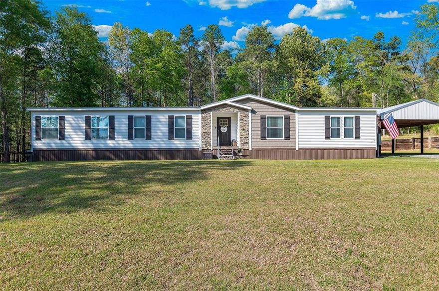 AMAZING!!! This home has so many extras! This gorgeous home sits on just under an acre of land surrounded by privacy! Enjoy the peace and quiet of Country Living at its Finest! Walk in to a huge living area, perfect for entertaining, built in cabinets, and  gorgeous electric fireplace, perfect ambiance. Can I say DREAM KITCHEN! Cabinets, Cabinets, and more Cabinets, you will never run out of space in this kitchen, gorgeously designed and no detailed spared. Oversized farm sink, huge island for prep work and entertaining, large sitting area, and accent wall! Oversized Primary suite is fit for royalty, a huge designed walk in closet with storage galore. Primary bath is like your own spa get away! Large soaker tub with huge walk in shower! Spare bedrooms are large with plenty of space! Large covered patio great for gatherings, entertaining, or just enjoy a cup of coffee in the peace and quiet of country living! Two car carport. 12x14 shed with 2 lofts, insulated, AC, great for all your exterior storage. This home has been immaculately taken care of and is in pristine condition! Call today for a showing! You will not be disappointed!