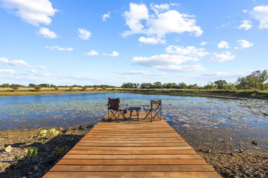 55 Acre Sportsman Paradise – Private, Peaceful, and Full of Possibilities!  Sleep in the cabin beside the pond and give the visiting relatives the apartment built inside the barn.  

Escape the city and unwind on this breathtaking 55-acre retreat in Honey Grove (sweetest town in Texas)! A rare combination of rolling pasture, mature oak and cypress along with a winding creek creating a peaceful haven that feels worlds away but an easy drive from the DFW Metroplex.

At the heart of the property lies a picturesque pond teeming with bass, perfect for fishing or simply relaxing on the dock as you listen to the gentle splash of fish and frogs. Overlooking the pond is a charming weekend cabin, designed for comfort and connection to nature. Inside, you’ll find an inviting living area, full kitchen, laundry, one bedroom, and one and a half baths. The bright sunroom with panoramic pond views is an ideal spot to sip morning coffee or watch the sunset shimmer across the water. A private walkway leads down to the dock, where peaceful reflection comes easy.

For the outdoor enthusiast; fish, hunt, explore, or simply take in the spectacular sunrises and sunsets that light up the horizon. The new Ralph Hall Lake and Bois D'Arc Lake are both nearby!

A 40x30 shop offers room for all your toys, complete with two 14' roll-up doors, a 10' door with electric opener, and a convenient bathroom inside. The shop also includes a 960 sq ft 1-bed, 1-bath apartment, offering extra living space for guests, family, or rental opportunities. A 20x24 outbuilding with electric provides additional storage or workshop potential—your blank canvas to make your own.

With no known restrictions, outside city limits, and located in highly regarded Chisum ISD, this property offers unlimited potential—whether you envision a dream home, barndominium, family compound, or continued use as a private weekend getaway.

Private. Peaceful. Perfectly North Texas. This is the escape you’ve been waiting for.